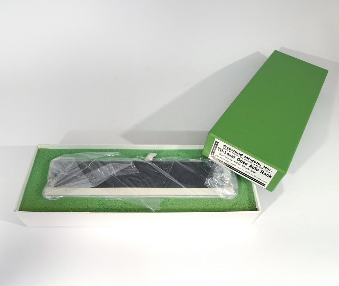 Early 2000's Overland Models by Ajin Precision (Korea): Early 2000's Overland Models by Ajin Precision (Korea) unpainted brass Tri-Level open auto rack carrier in original box. Auto carrier car is still factory wrapped in cardboard surround. Car is 12" lon