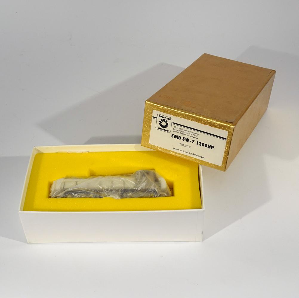 1990's Oriental Limited Models by Samhongsa (Korea): 1990's Oriental Limited Models by Samhongsa (Korea) unpainted brass EMD SW-7 1200HP Phase I diesel engine in original box. This Korean made diesel is a phase 1 SW-7 model. Original box comes with inse