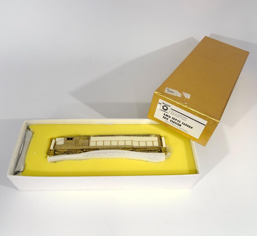 1990's Oriental Limited Models by Samhongsa (Korea) HO: 1990's Oriental Limited Models by Samhongsa (Korea) unpainted brass EMD SDP 45 3600HP Erie RR version diesel engine in original box. Engine measures 9" long. Original box has insert.