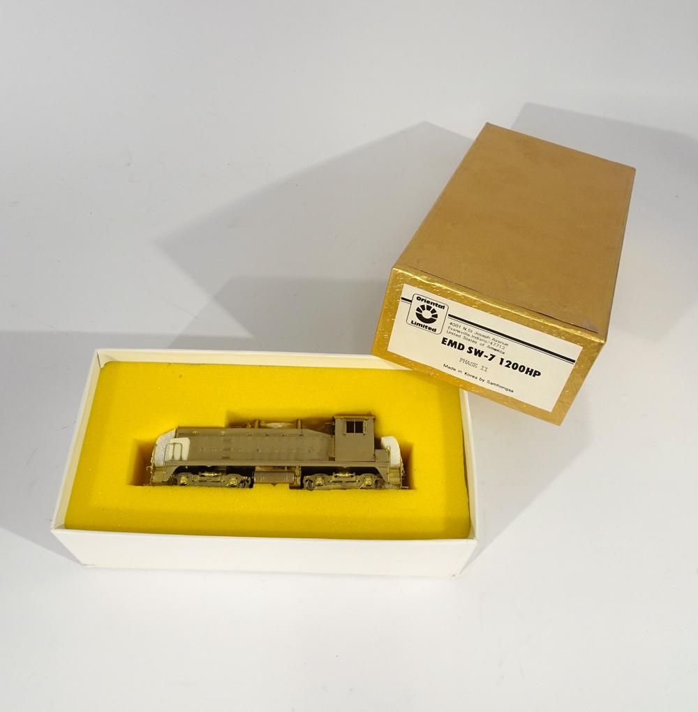 1990'sOriental Limited Model by Samhongsa (Korea): 1990's Oriental Limited Models by Samhongsa MFG. (Korea) unpainted brass HO gauge EMD SW-7 1200HP Phase 2 Diesel switcher in original box. Engine measures a little over 5" long. Original box has inser