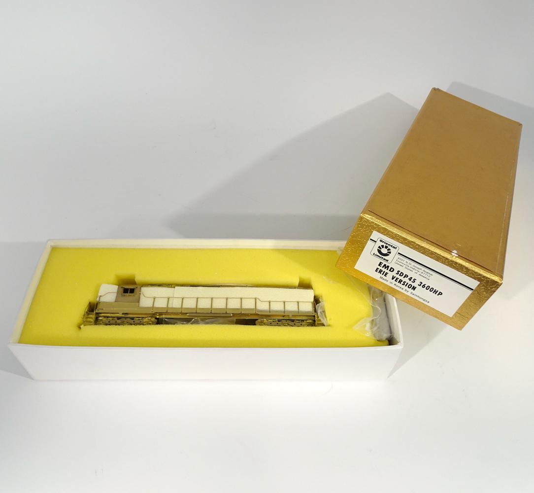 1990's Oriental Limited Models by Samhongsa MFG.: 1990's Oriental Limited Models by Samhongsa MFG. (Korea) unpainted brass HO gauge EMD SDP45 3600 HP Diesel switcher (Erie RR version) in original box. Diesel engine measures 9" long. Original box has 
