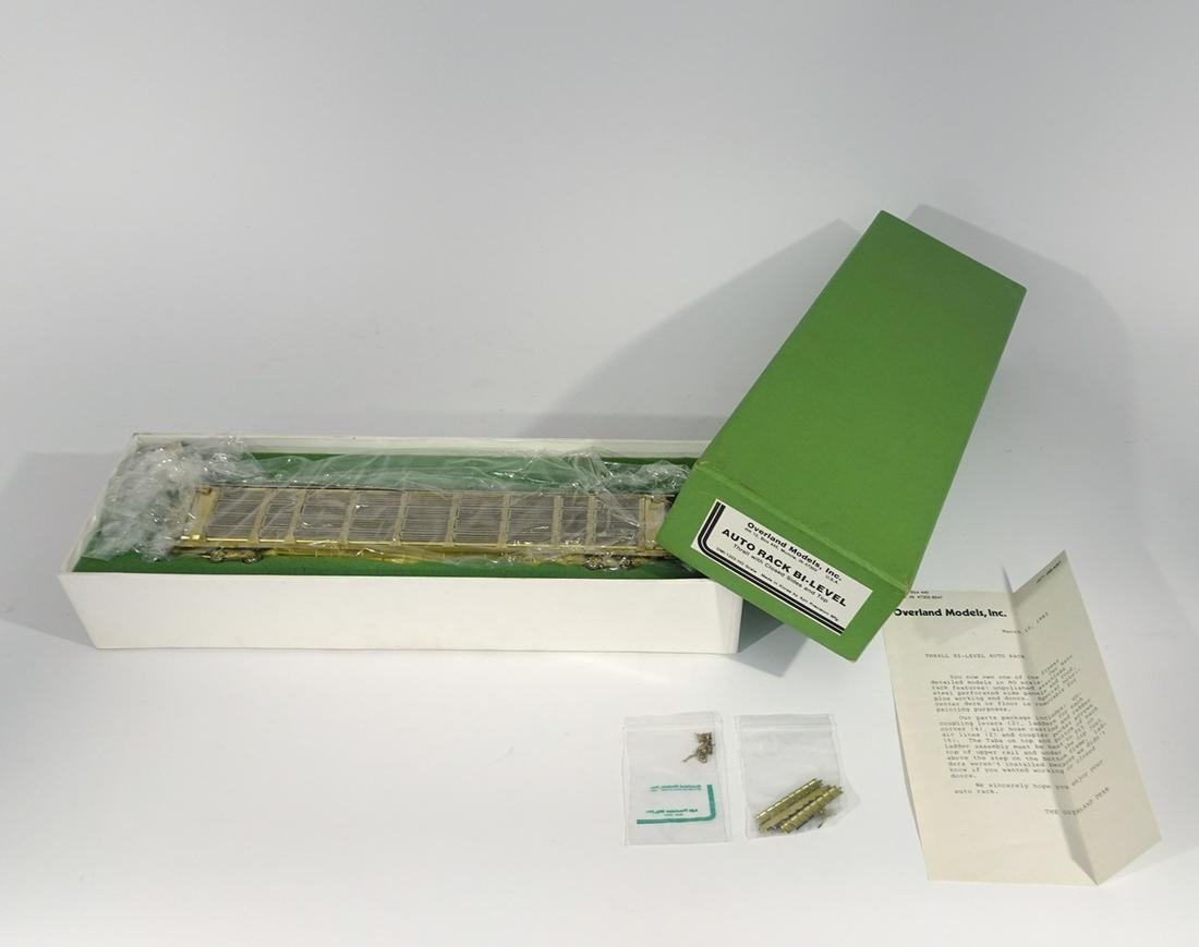 2000's Overland Models by Ajin Precision Mfg. (Korea): 2000's Overland Models by Ajin Precision Mfg. (Korea) unpainted brass HO gauge Bi-Level auto transport with closed sides and top in original box. Car measures almost 13" long. Original box has insert.