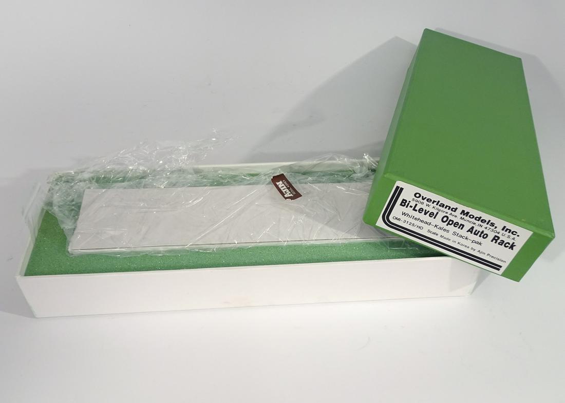 2000's Overland Models by AJIN Precision Mfg. (Korea): 2000's Overland Models by AJIN Precision Mfg. (Korea) unpainted brass HO gauge Bi-Level auto transport with open sides and top in original box. Original box has insert. Car measures almost 12" long.
