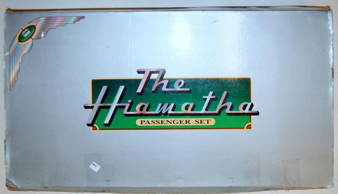 1988 Lionel re-issue of the 1930's five piece Hiawatha: 1988 Lionel re-issue of the 1930's five piece Hiawatha passenger set with original box. This all metal set in Milwaukee Road paint scheme is headed by a 4-4-2 Streamlined steam engine, two coaches and