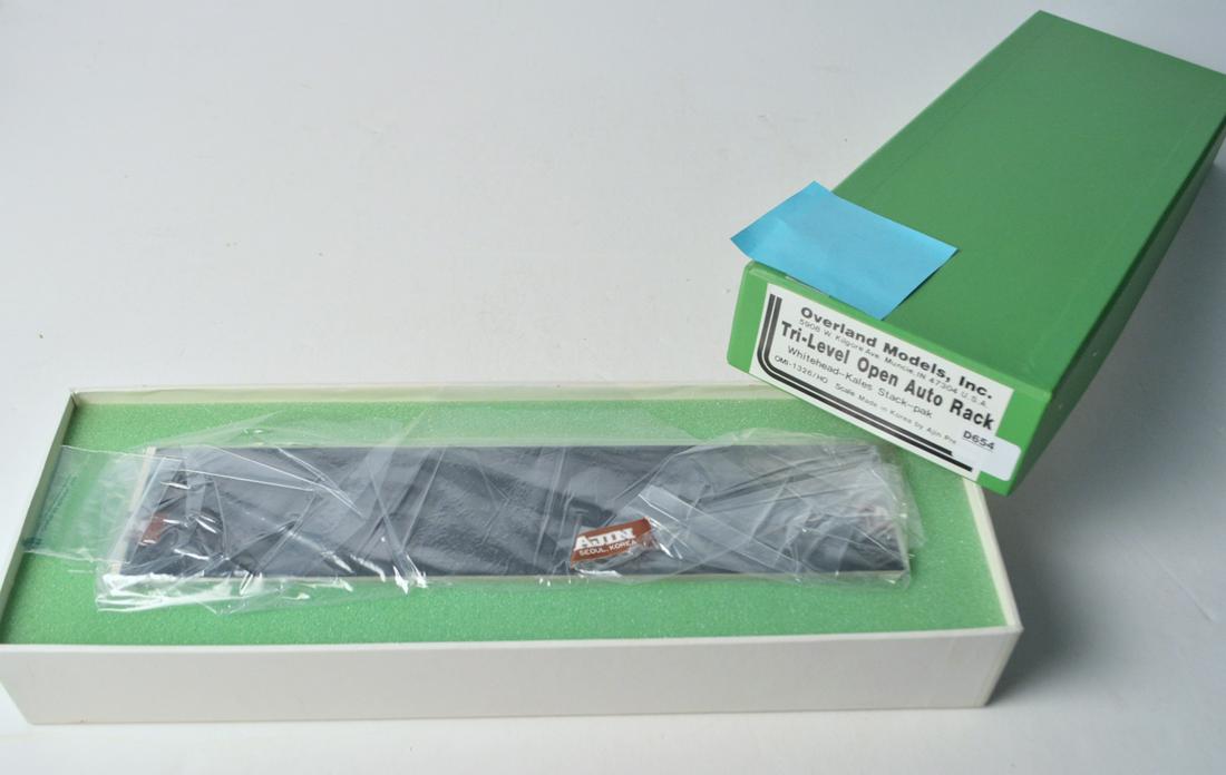 1990's Overland Models by AJIN (Korea) Tri-level open: 1990's Overland Models by AJIN (Korea) Tri-level open rack auto transport in original box. Auto transport is still wrapped in original plastic.
