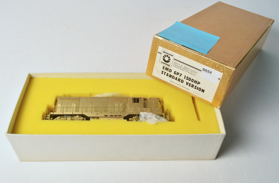 1990's Oriental Limited by Samhongsa (Korea) unpainted: 1990's Oriental Limited by Samhongsa (Korea) unpainted brass HO gauge EMD GP-7 diesel locomotive in original box. Engine looks like it was never run. Needs couplers.