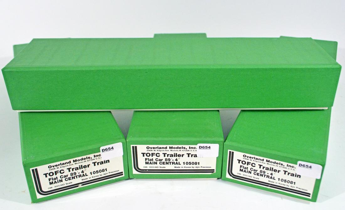 Four 2000's Overland Models by AJIN (Korea) unpainted: Four 2000's Overland Models by AJIN (Korea) unpainted brass HO gauge TOFC Trailer Train flat car kits. These kits are still sealed. Flat cars measure approx. 12" long.