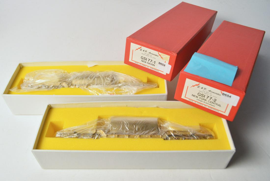 Two 1990's E&P Associates by Samhongsa (Korea) GSI-77: Two 1990's E&P Associates by Samhongsa (Korea) GSI-77 unpainted brass HO gauge depressed center flat cars in original boxes. Both flat cars measure 10" long and have a brass tank mounted on each. Both