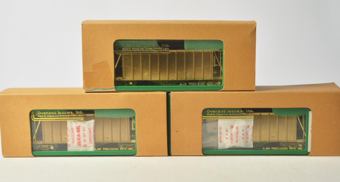 Three 2000's Overland Models by AJIN (Korea) unpainted: Three 2000's Overland Models by AJIN (Korea) unpainted brass HO gauge Airslide Covered Hoppers in original boxes. All three cars come in plastic display boxes with cardboard sleeves.