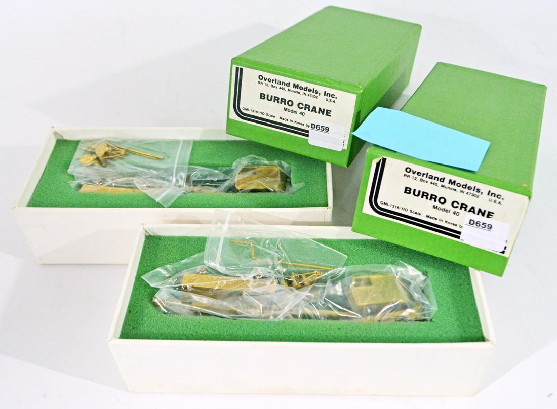Two Overland Models by AJIN (Korea) unpainted brass HO: Two Overland Models by AJIN (Korea) unpainted brass HO gauge non-motorized Model 40 Burro cranes with tool flat. These two Burro cranes are still wrapped in their original plastic.