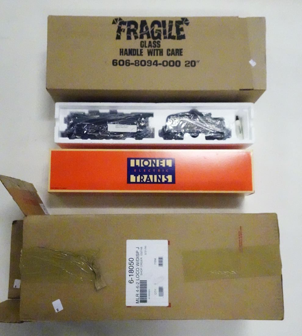 1996 Lionel O gauge #18050 JC Penny Co. Exclusive: 1996 Lionel O gauge #18050 JC Penny Co. Exclusive 4-6-2 steam engine and tender with display stand and all original boxes with shipping box. Locomotive is #2055 and has PENNSYLVANIA printed on tender.