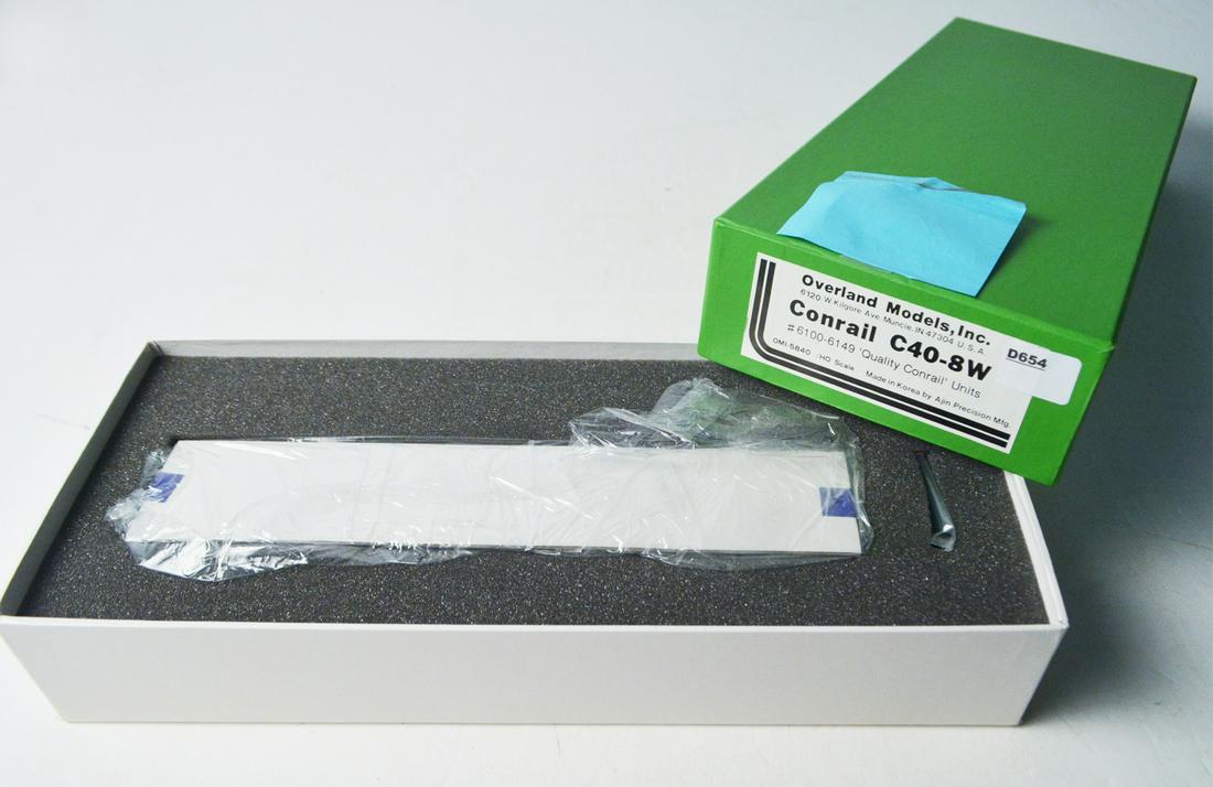 1990's Overland Models by AJIN (Korea) unpainted HO: 1990's Overland Models by AJIN (Korea) unpainted HO gauge brass Conrail C40-8W diesel engine. Engine measures about 10" long. Still sealed inside original box.