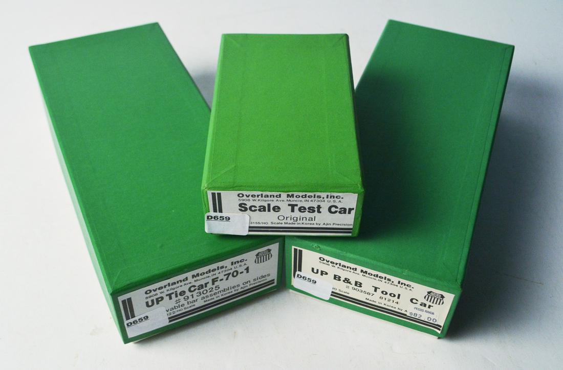 Three 1990's Overland Models by AJIN (Korea) unpainted: Three 1990's Overland Models by AJIN (Korea) unpainted brass HO gauge M.O.W. cars in original boxes. The cars consist of a scale test car (about 2" long), a UP Tie carrying F-70 car (about 8" long), a