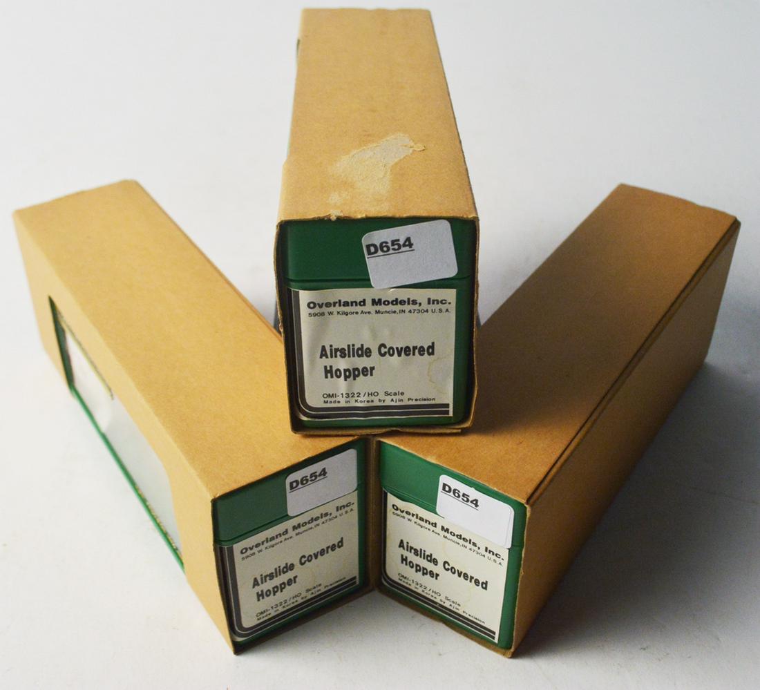Three 1990's Overland Models by AJIN (Korea) unpainted: Three 1990's Overland Models by AJIN (Korea) unpainted brass HO gauge Airslide covered hoppers in original boxes. All 3 hoppers are mint inside plastic original boxes. They measure about 5" long.