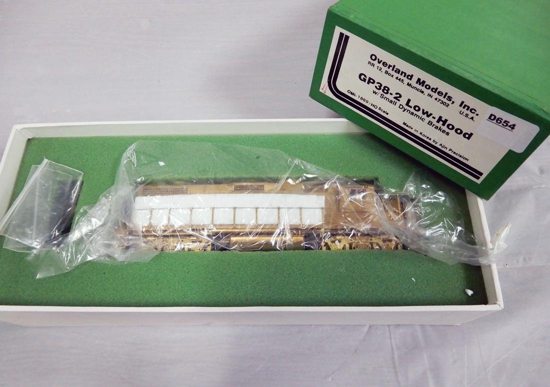 1990's Overland Models by AJIN (Korea) unpainted brass: 1990's Overland Models by AJIN (Korea) unpainted brass HO gauge GP-38-2 low hood diesel with small dynamic brakes. Engine is about 8" long. Still wrapped inside its original box.