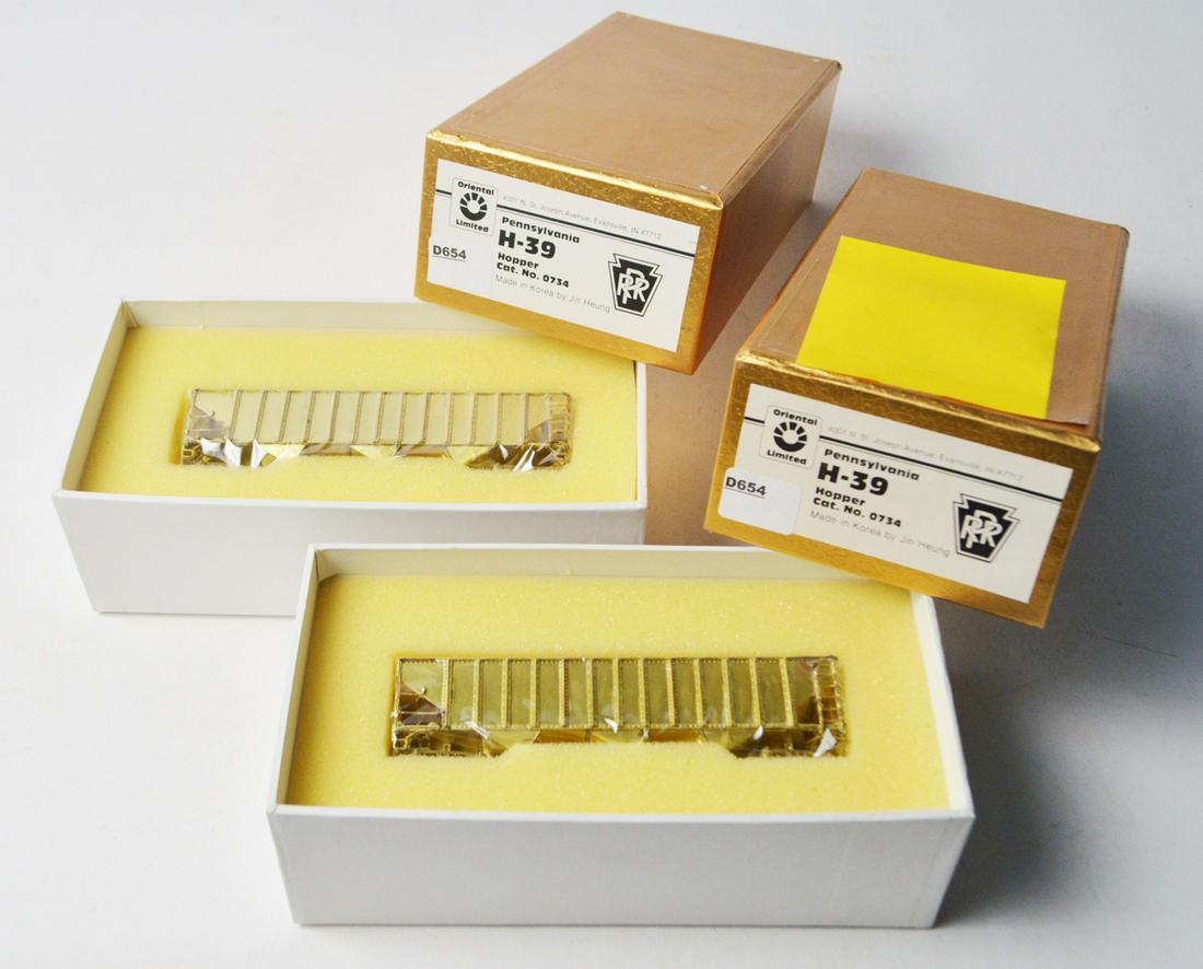 Two 1990's Oriental Limited made by Jin Heung (Korea): Two 1990's Oriental Limited made by Jin Heung (Korea) unpainted brass HO gauge PRR H-39 three bay hoppers in original boxes. Both hoppers are still wrapped inside their original boxes.