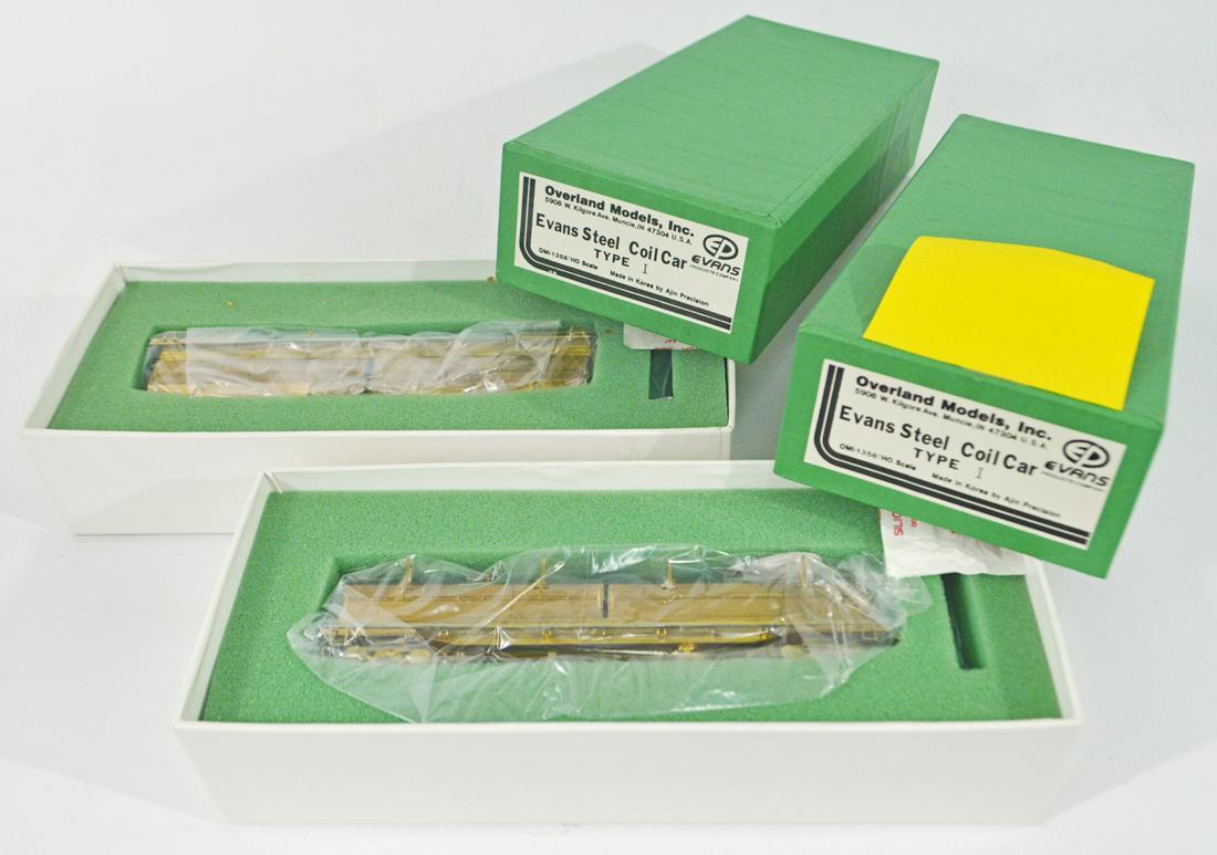 Two 1990's Overland Models by AJIN (Korea) unpainted: Two 1990's Overland Models by AJIN (Korea) unpainted brass HO gauge Evans Steel Coil Cars (Type 1) in original boxes. Cars measure 7" long. Both cars are wrapped inside their original boxes.
