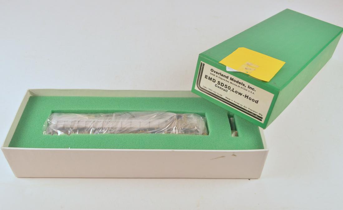 1990's Overland Models by AJIN (Korea) unpainted brass: 1990's Overland Models by AJIN (Korea) unpainted brass HO gauge EMD SD-40 low hood in original box. Engine is still sealed inside original box. Diesel measures about 9" long.