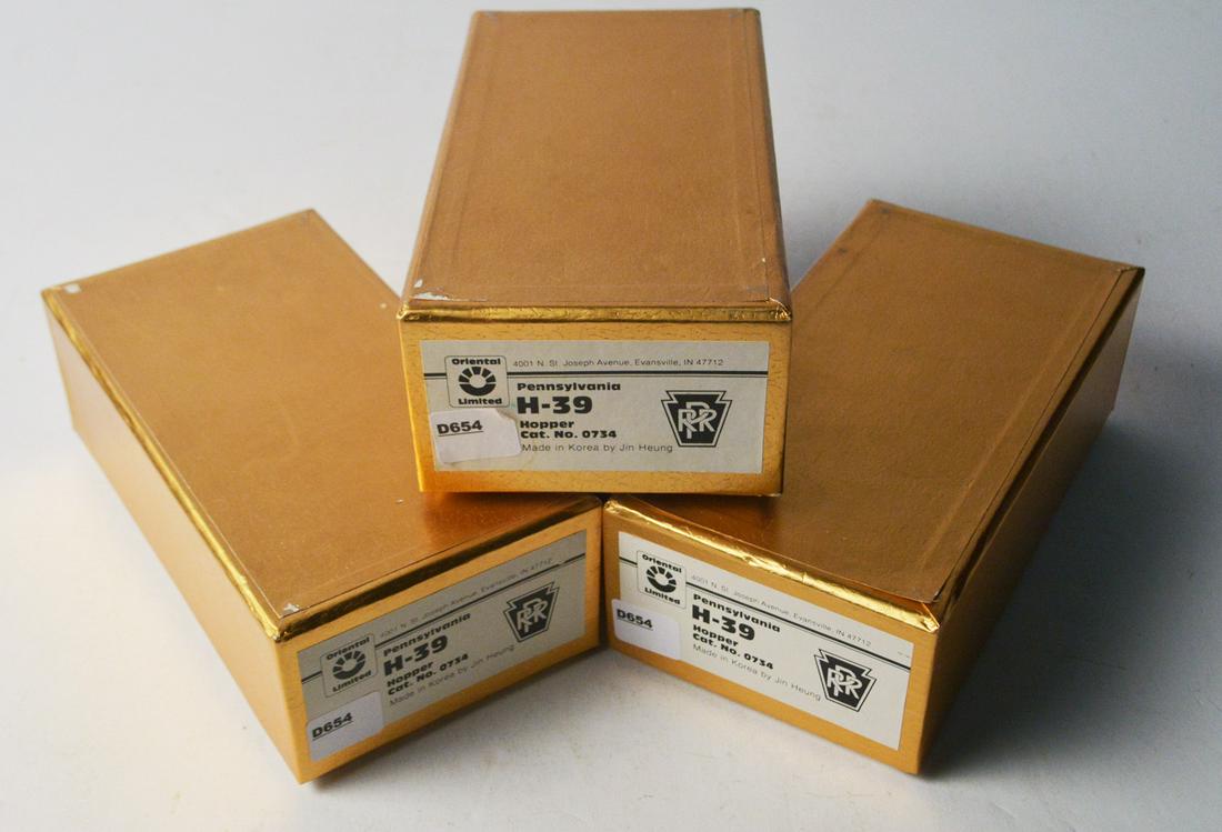 Three 1990's Oriental Limited by Jin Heung (Korea): Three 1990's Oriental Limited by Jin Heung (Korea) unpainted brass HO gauge PRR H-39 three bay hopper cars in original boxes.