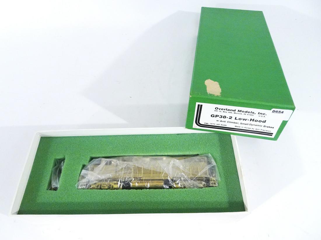 1990's Overland Models by AJIN: 1990's Overland Models by AJIN (Korea) unpainted HO gauge GP38-2 low hood diesel engine in original box. Engine is about 8" long. Still wrapped in factory plastic.