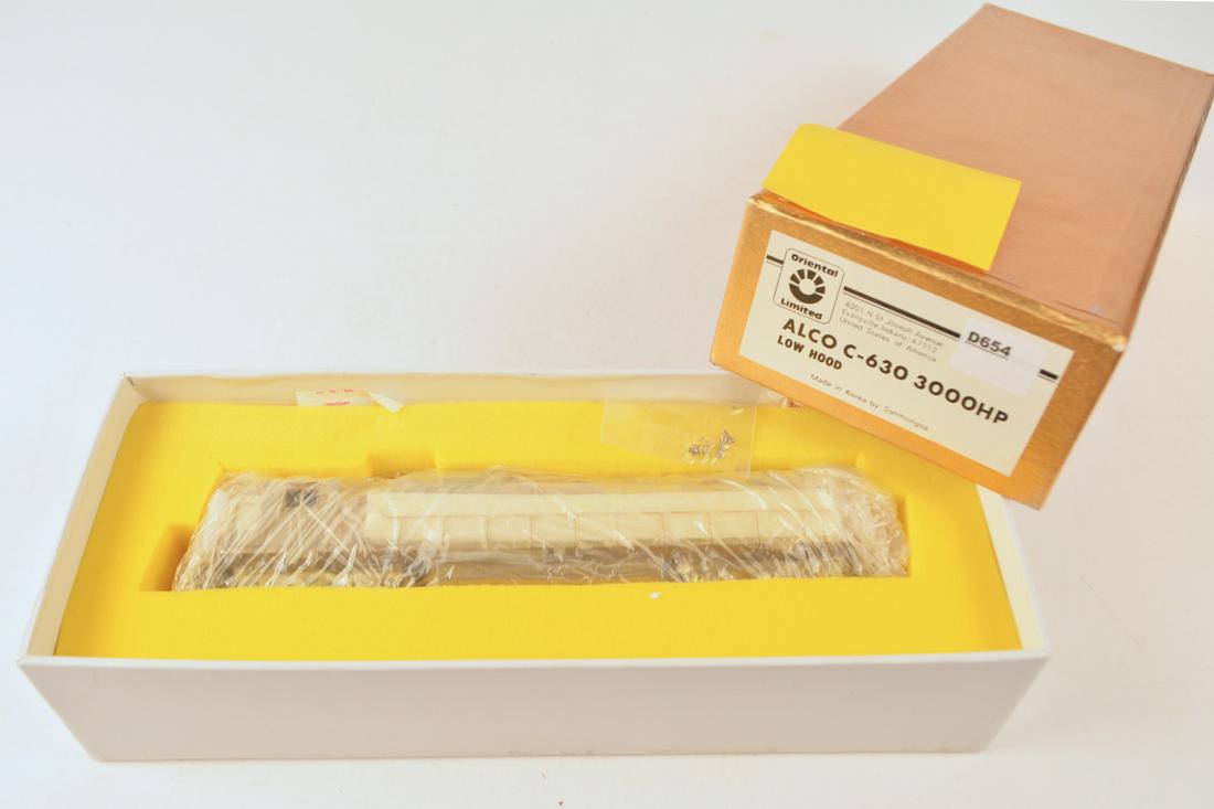 1990's Oriental Limited by Samhongsa (Korea) unpainted: 1990's Oriental Limited by Samhongsa (Korea) unpainted brass HO gauge ALCO c-630 3000HP low hood diesel in original box. Engine measures over 9" long. Still wrapped in factory plastic.