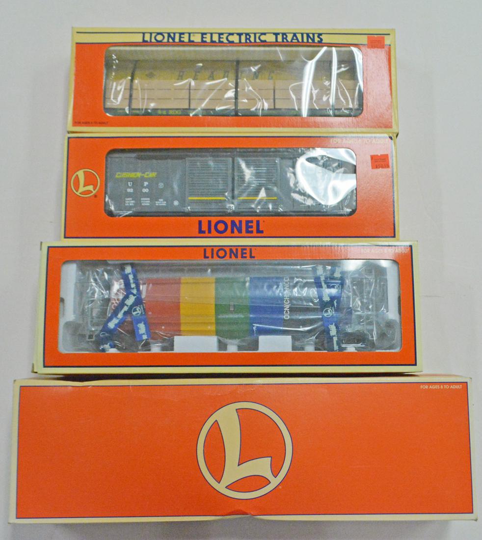 Four modern era Lionel O scale freight cars in original: Four modern era Lionel O scale freight cars in original boxes. These are the larger and longer cars that are sometimes called Standard O gauge. The cars are #51600 NYC depressed center flat car with g