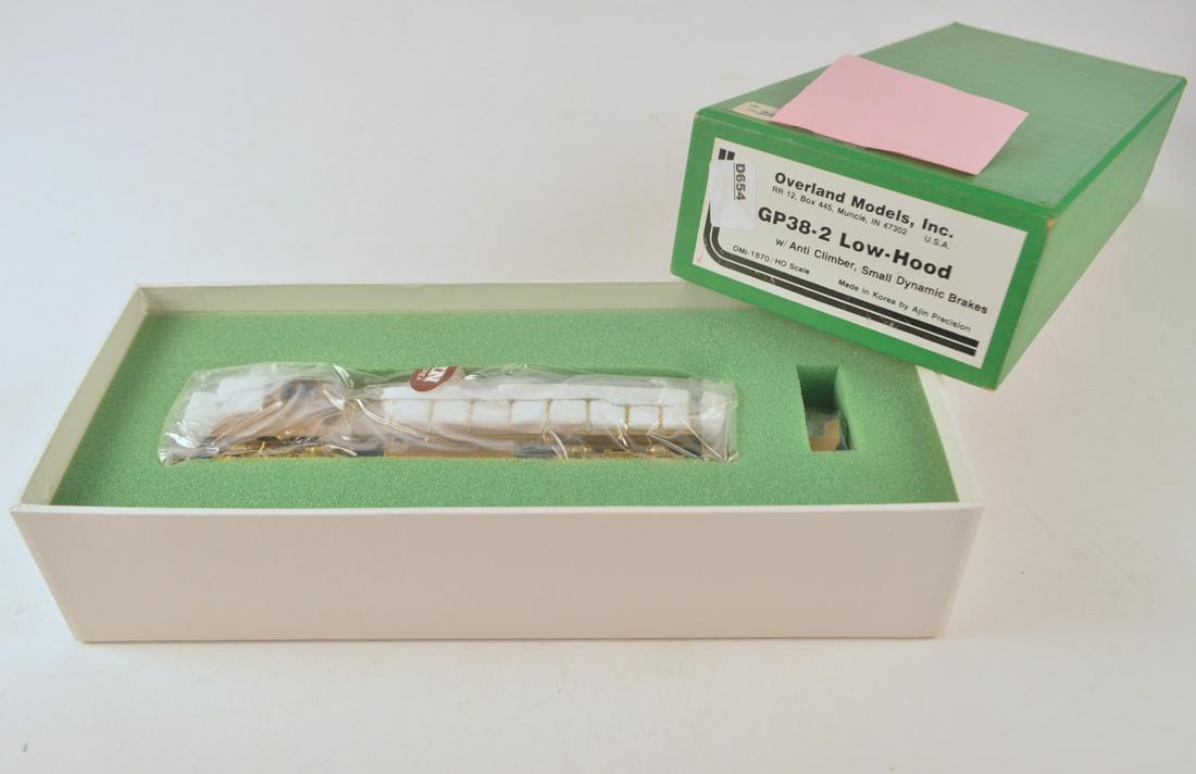 1990's Overland Models y AJIN (Korea) unpainted brass: 1990's Overland Models y AJIN (Korea) unpainted brass HO gauge GP-38-2 low hood diesel engine in original box. Engine still wrapped in factory plastic.