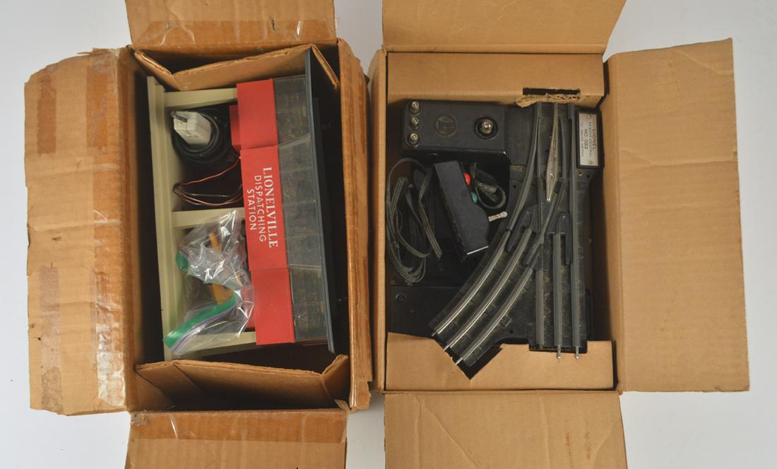 Two 1950'S Lionel O gauge platform accessories in: Two 1950'S Lionel O gauge platform accessories in original boxes. #465 Sound Dispatching Station. It is complete. Original box has slight loss. A pair of #022 Remote control switches for O gauge train