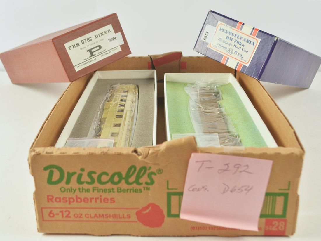 Two 1980's unpainted brass HO gauge heavyweight: Two 1980's unpainted brass HO gauge heavyweight passenger cars in original boxes. Includes a NJ Custom Brass by Sung Jin (Korea) BM-70KA baggage/mail car that measures 10" long, The P Co. by Daeki (Ko