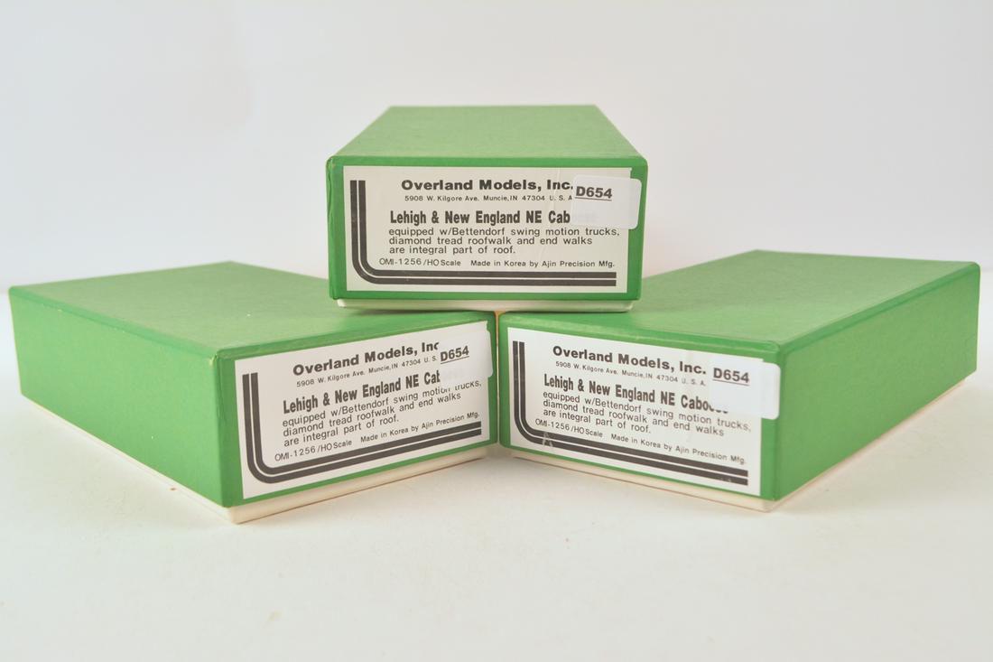 Three 1990's Overland Models by AJIN (Korea) unpainted: Three 1990's Overland Models by AJIN (Korea) unpainted brass HO gauge Lehigh & New England NE cabooses in original boxes. Labels say that these are equipped with Bettendorf swing motion trucks and dia