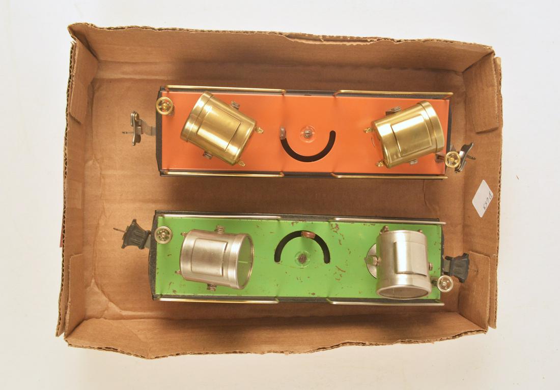Two 1930's pre-war Lionel O gauge Searchlight cars #'s: Two 1930's pre-war Lionel O gauge Searchlight cars #'s 820 and 2820. The #820 double searchlight car is the terra-cotta and black version with brass lights. This car may be a total restoration. The #2