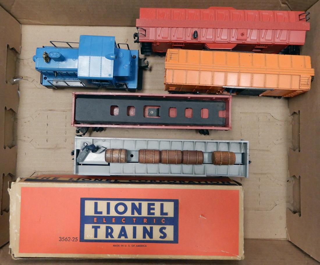 1950's Lionel O gauge engine and freight cars: 1950's Lionel O gauge engine and four freight cars. Blue #51 Navy yard switcher engine. It has one cracked window strut. A #6517 Lionel Lines bay window caboose (built date underscored), a #3454 Santa