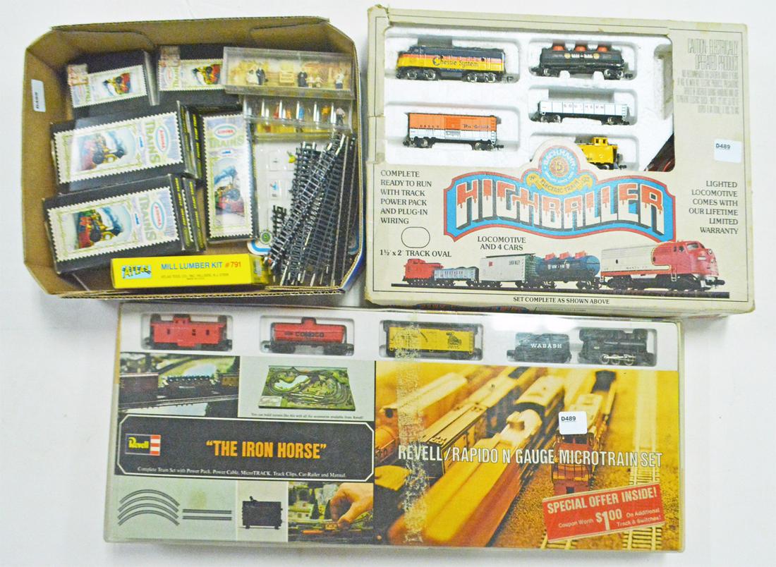 Two N gauge boxed sets and a tray of platform: Two N gauge boxed sets and a tray of platform accessories. The first set is a 1960's Revell Iron Horse set with an 0-6-0 steam engine, tender, box car, tank car, caboose, set box, track and power pack