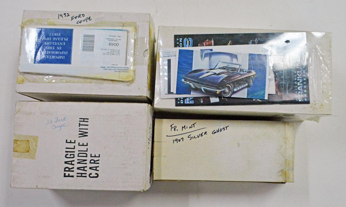 Four 1980's Franklin Mint die-cast cars in boxes: Four19 80's Franklin Mint die-cast cars in boxes. The lot consists of a 1907 Rolls Royce Silver Ghost convertible (Hong Kong). Moisture damage to exterior box. Two 1932 Ford Coupe (China). A 1967 124t