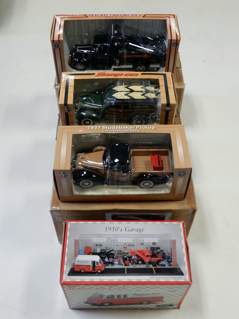 Four 2000's Crown Premiums Snap On Tool collectible: Four 2000's Crown Premiums Snap On Tool collectible vehicles in original boxes. SOT 1950 red and white Ford Step Van (2002), SOT black 1934 Ford tow truck (2003), SOT 1937 Studebaker Woody wagon with
