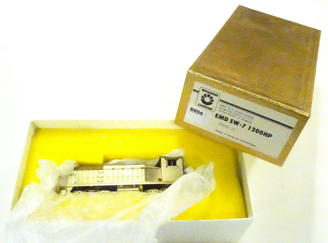 1990's Oriental Limited by Samhongsa (Korea) unpainted: 1990's Oriental Limited by Samhongsa (Korea) unpainted brass HO gauge EMD SW-7 1200HP Phase II diesel engine in original box. Still wrapped in factory wrapping.