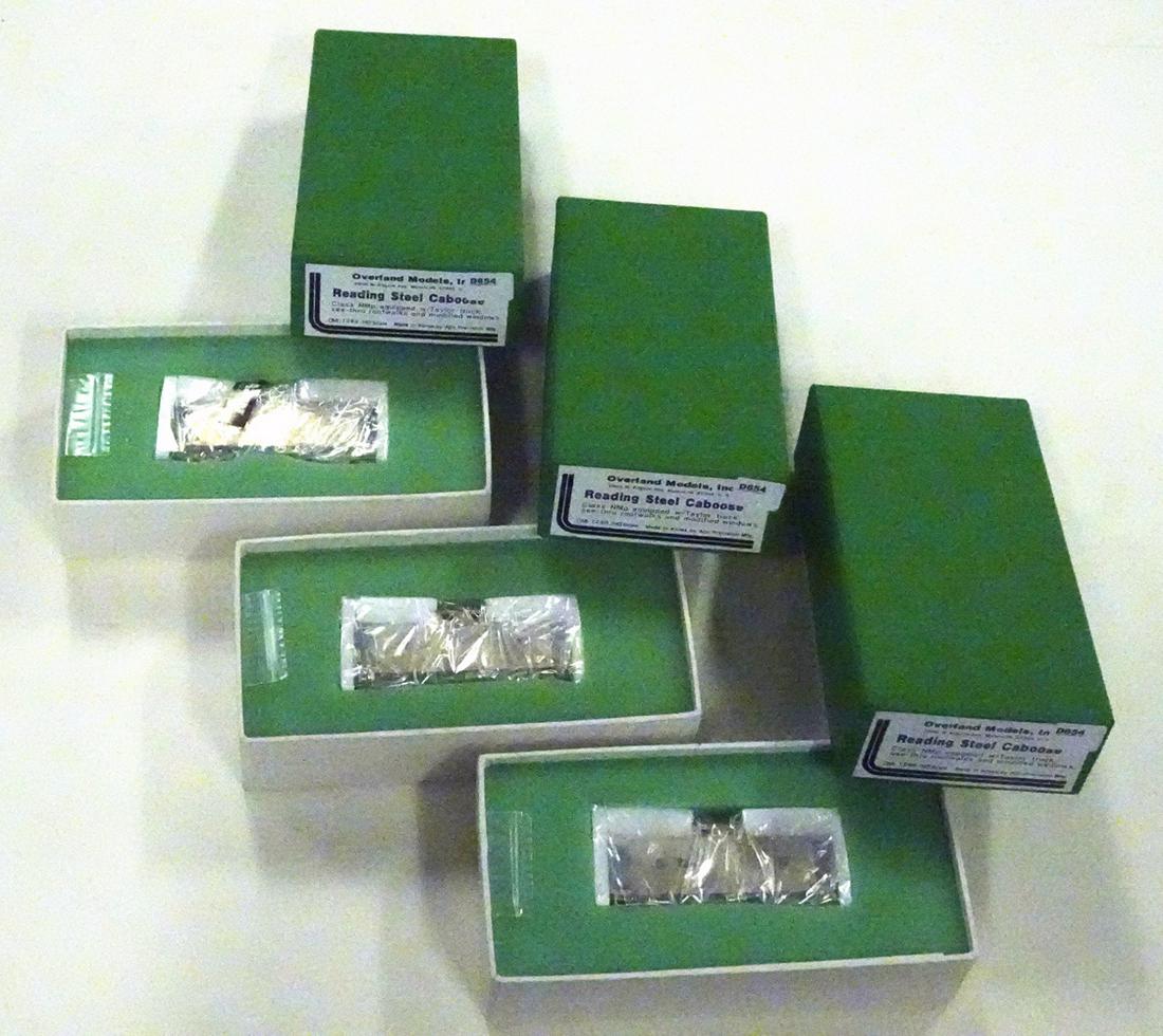 Three 1990's Overland Models by AJIN (Korea) unpainted: Three 1990's Overland Models by AJIN (Korea) unpainted brass HO gauge Reading RR Steel cabooses in original boxes. All three cabooses are still in factory wrapping.