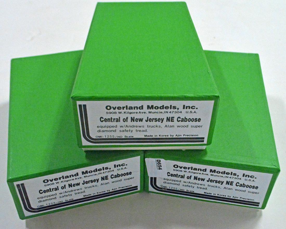 Three 1990's Overland Models by AJIN (Korea) unpainted: Three 1990's Overland Models by AJIN (Korea) unpainted brass HO gauge Central of New Jersey NE cabooses in original boxes. All three cabooses are still factory wrapped.