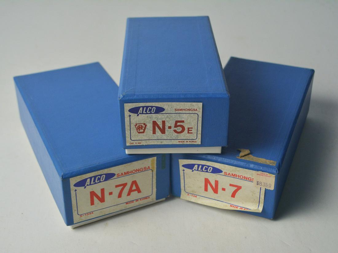 Three 1970's ALCO Models by Samhongsa (Korea): Three 1970's ALCO Models by Samhongsa (Korea) unpainted HO gauge N-7, N-7A & N-5e cabooses in original boxes. Original boxes have shelf wear.