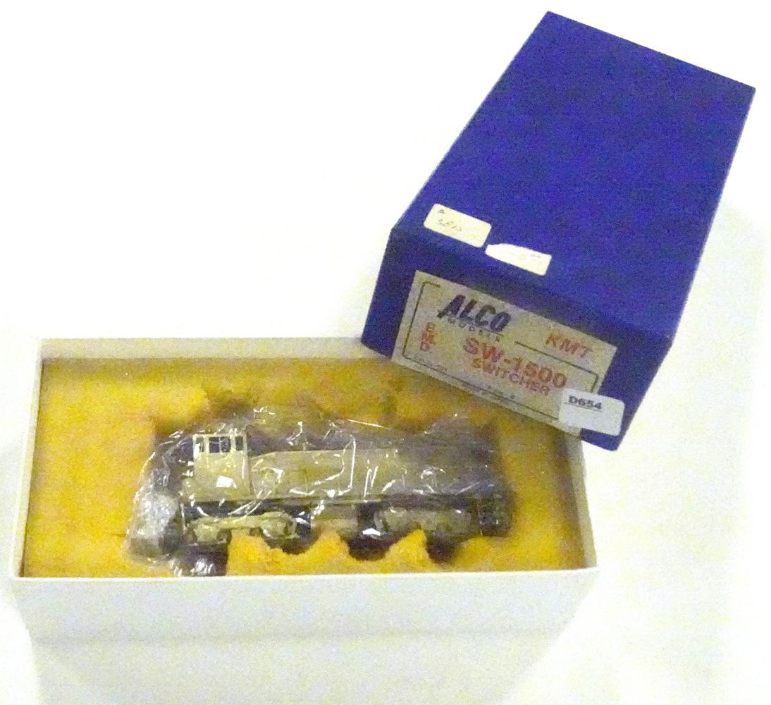 1970's ALCO Models by KMT (Japan) unpainted brass HO: 1970's ALCO Models by KMT (Japan) unpainted brass HO gauge SW-1500 Diesel switcher in original box. Foam insert deteriorating but engine is still wrapped in plastic.