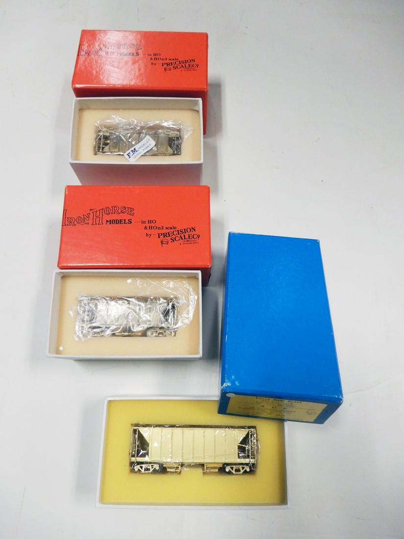 Three 1970's-1980's unpainted brass HO gauge covered: Three 1970's-1980's unpainted brass HO gauge covered hoppers by Precision Models and Pecos River Brass in original boxes. There are two Precision Scale Models by FM Models (Korea) Erie RR 50 ton cover