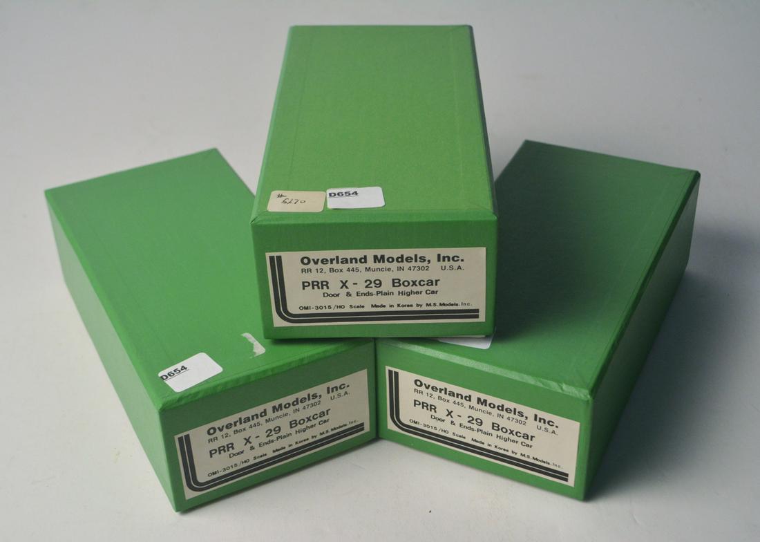 Three 1990's Overland Models by AJIN (Korea) unpainted: Three 1990's Overland Models by AJIN (Korea) unpainted brass HO gauge PRR X-29 box cars in original boxes. All three box cars are still wrapped in factory plastic.