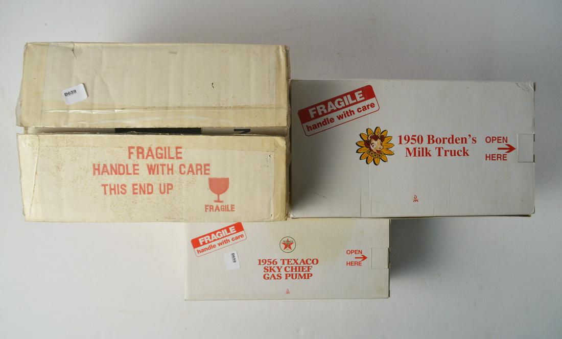 Two 1990's Danbury Mint die cast metal and plastic: Two 1990's Danbury Mint die cast metal and plastic 1:24th scale replica vehicles and a diorama display stand for either cars or motorcycles. All in original boxes. Borden's Milk Truck, 1956 Texaco Sky
