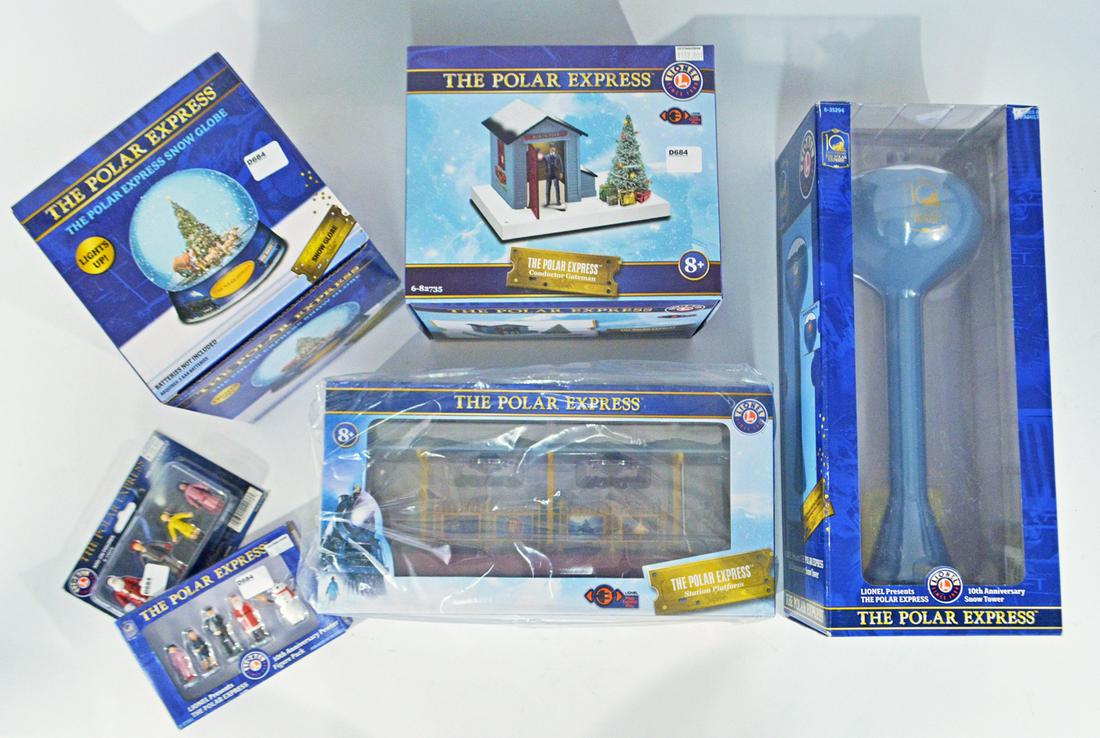 Six 2000's Lionel O gauge Polar Express platform: Six 2000's Lionel O gauge Polar Express platform accessories in original boxes. The lot consists of #73-5294-200 PE 10th anniv. water tower, #82735 PE operating gateman, #33063 PE light up snow dome, 