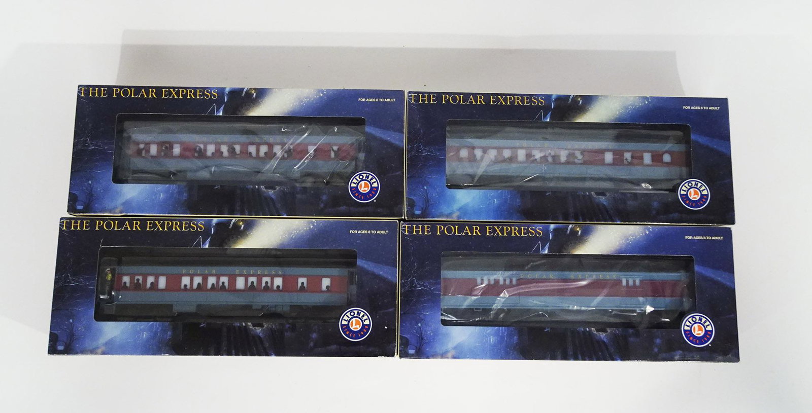 Four 2000's Lionel O gauge The Polar Express add-on: Four 2000's Lionel O gauge The Polar Express add-on heavyweight passenger cars in original boxes. The cars are #25134 PE Diner car, # 25135 PE Baggage car, #25186 PE Hot Chocolate car and #36875 PE Co