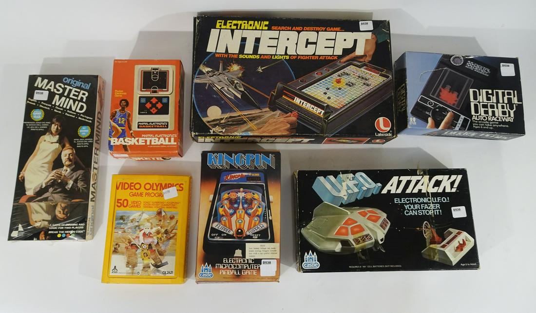 1970's assorted electronic games and game cartridges in: 1970's assorted electronic games and game cartridges in original boxes. The lot consists of 1978 hand held King Pin pin ball game, 1978 Digital Derby auto race game, 1978 Mattel Hand held basketball g
