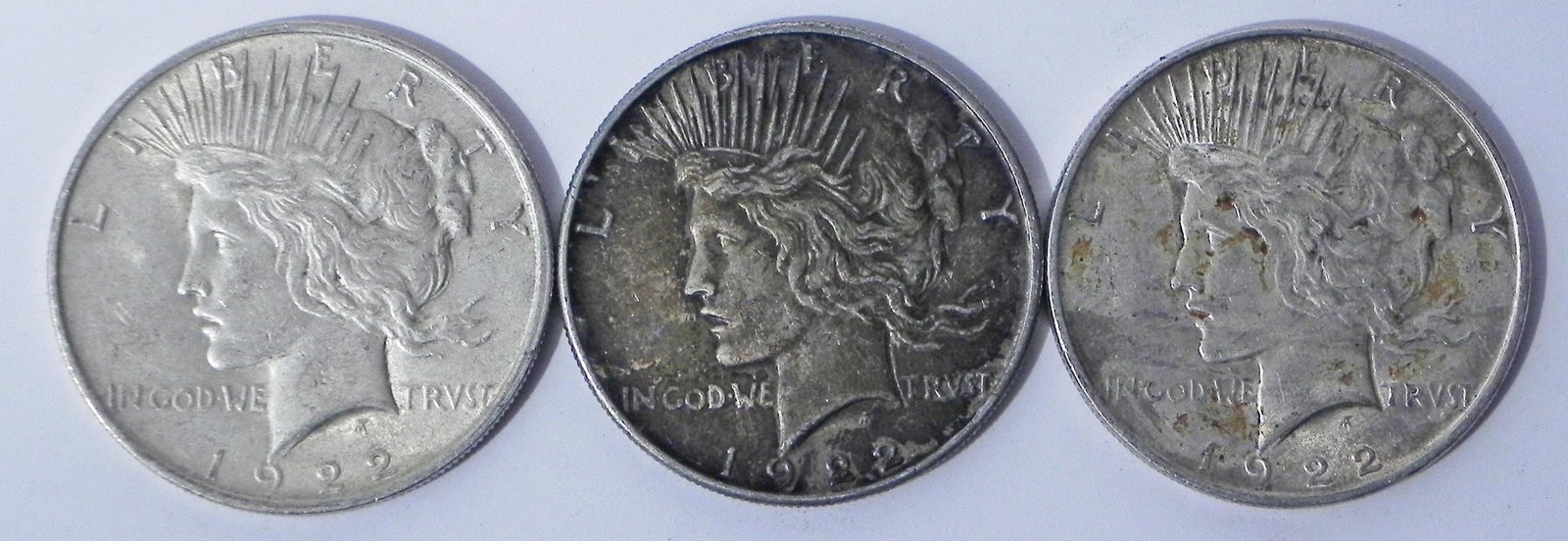 Three 1922 Peace silver dollars (1 of 2)