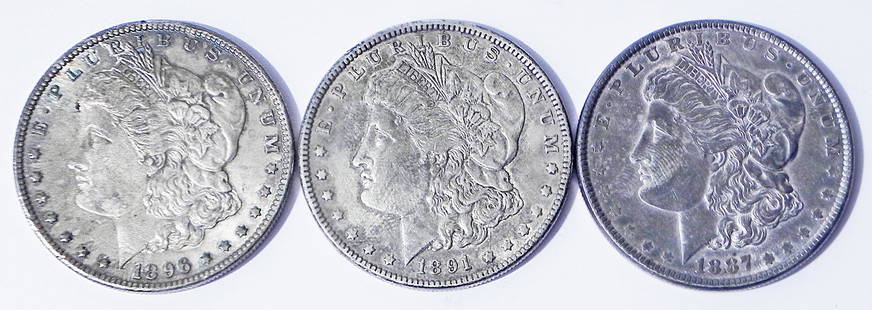 Three Morgan silver dollars: Three Morgan silver dollars, ungraded. 1887, 1891, 1896