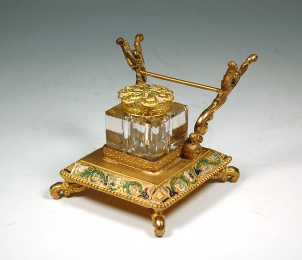 Bronze dore inkstand with attached pen holder, poly: Bronze dore inkstand with attached pen holder, polychrome painted decoration, cut glass inkwell, late 19th to early 20th C. Measures 3" x 3 1/4". Some loss to paint decoration.
