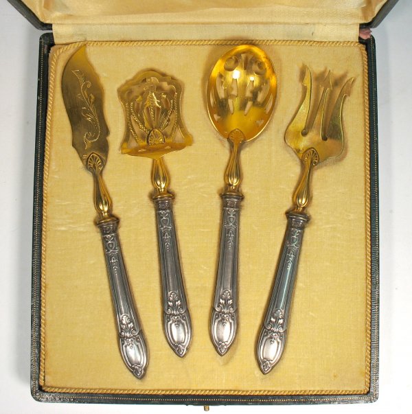 Set of four sterling flatware serving pieces with
